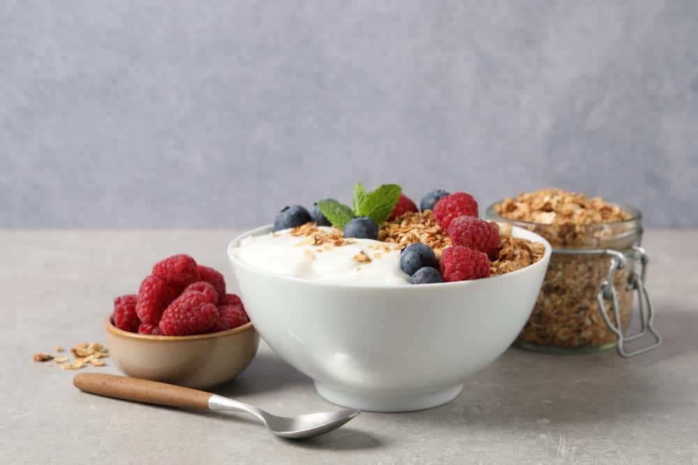 A bowl of granola, yogurt, and berries. Perfect for what to eat after a massage