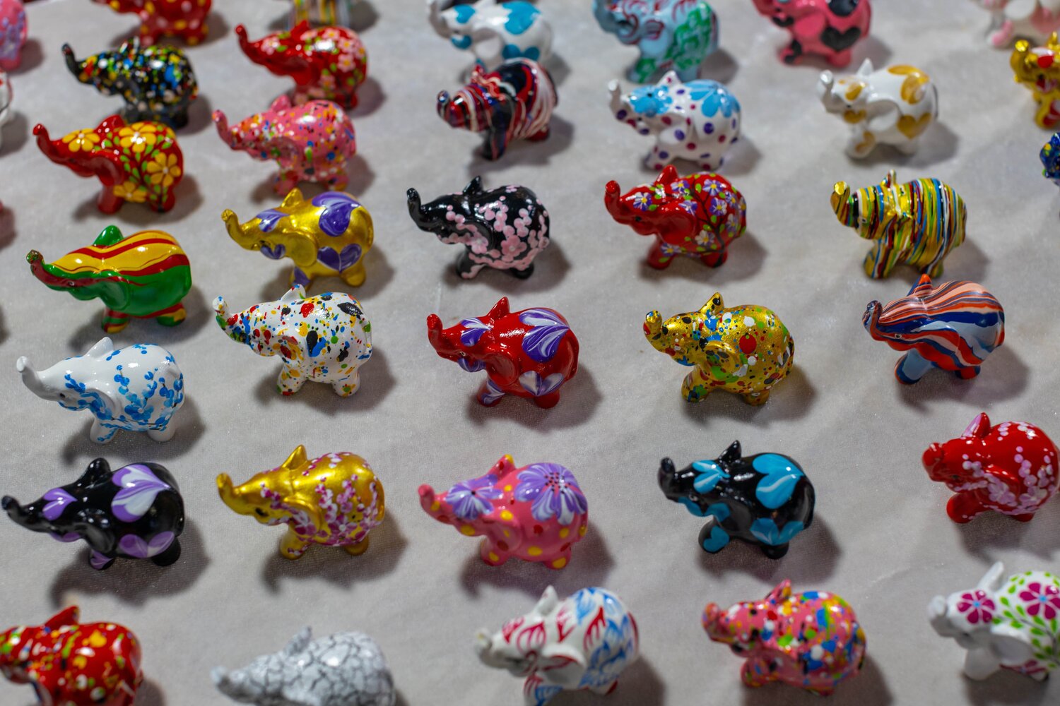 dozens of hand-painted elephants on display in Chiang Mai, Thailand