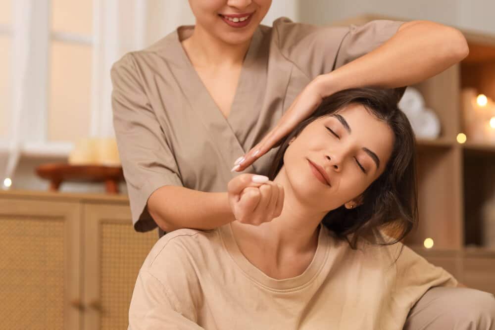 A woman getting a relaxing Thai massage