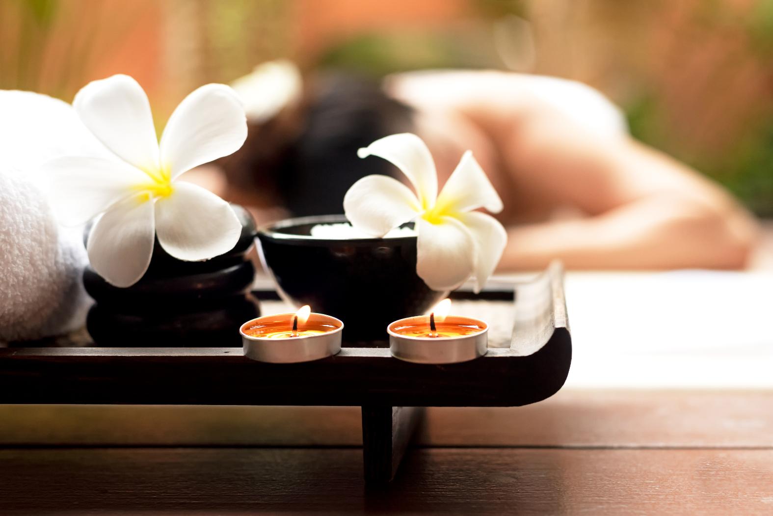 A woman getting a body scrub at the spa