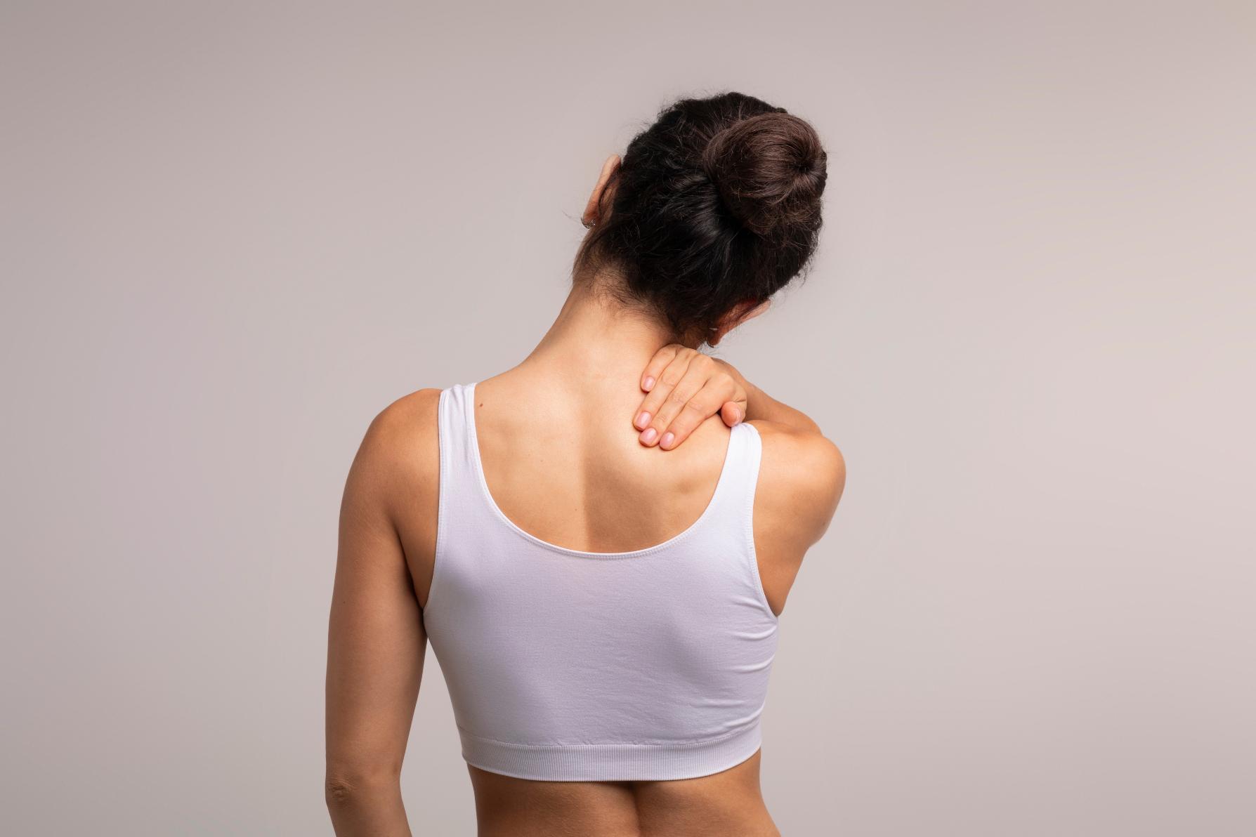 A woman needing a massage for back pain relief