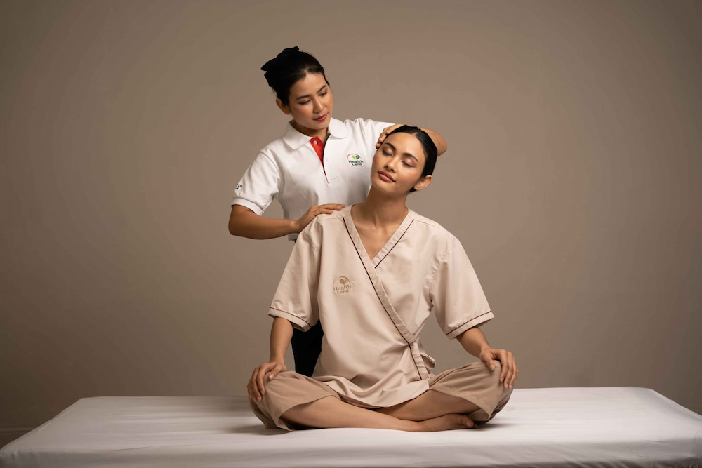 A therapist providing an authentic Thai massage experience in Bangkok at Health Land